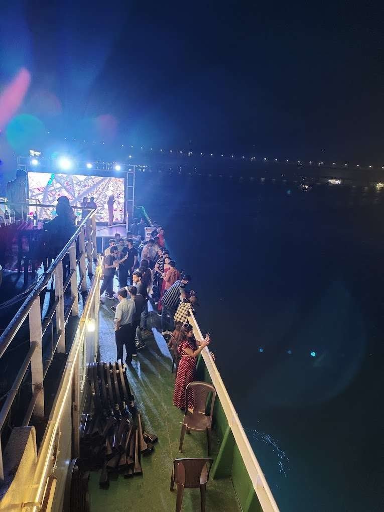 Illuminated cruise boat docked at night